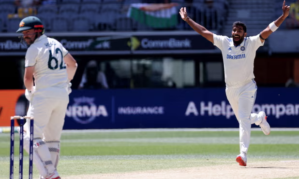 India's paceman Jasprit Bumrah celebrates the key wicket of Australia's Travis Head on day four of the first Test in Perth. 