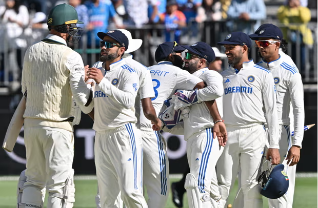 Virat Kohli shakes hands with Australia's Josh Hazlewood at the end of the match.