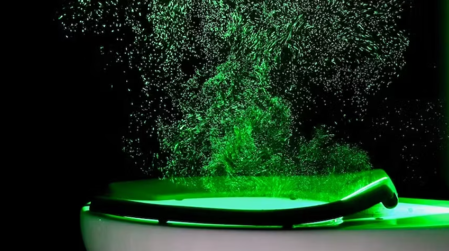 Vibrant Green Water Splash::A dynamic splash of green liquid against a dark background, creating an energetic visual contrast.