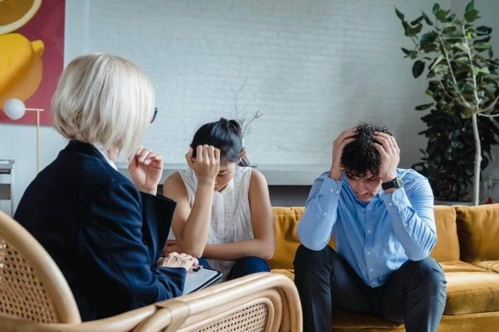 Why Half Of The Couples In Midlife Are In A Sexless Marriage 6 A therapist listens as a couple expresses their emotional distress during a counseling session.