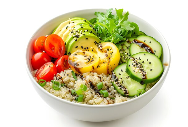 A vibrant bowl of quinoa topped with cherry tomatoes, sliced cucumbers, yellow and green squash, arugula, and sprinkled with sesame seeds.
