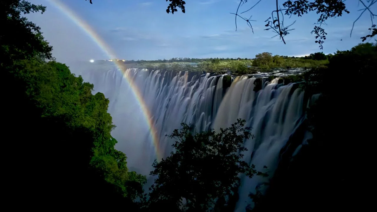 Lunar Rainbow Magic Draws Travelers to Victoria Falls Under Moonlit Skies